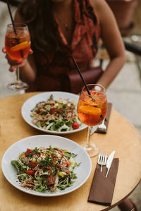 Midsection of food on table at restaurant