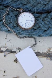 Directly above shot of pocket watch on rope