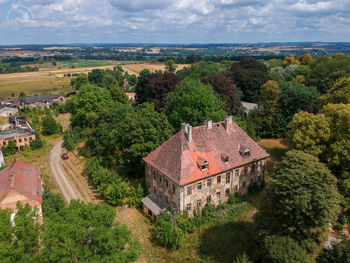 High angle view of trees and buildings against sky