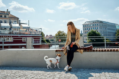 Woman walks with dog