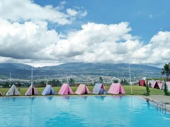 Boats in swimming pool against sky