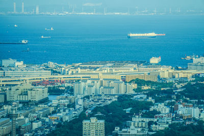 High angle view of buildings by sea