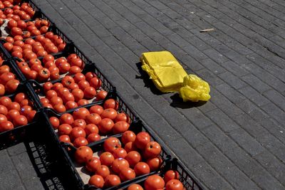 High angle view of fruits in container on street