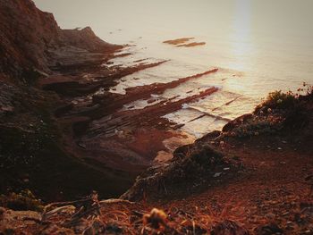 Scenic view of shore against sky