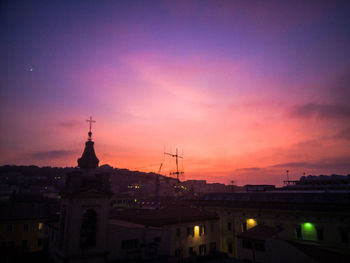 Cityscape against sky during sunset