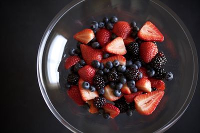 High angle view of strawberries in bowl on table