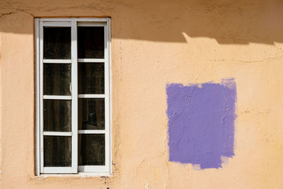 Full frame shot of window on wall of building