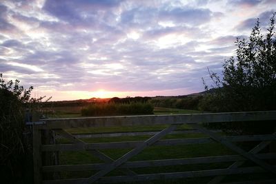 Scenic view of landscape against sky during sunset