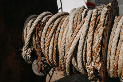 Close-up of rope tied up of rusty metal