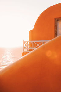 Close-up of sea against clear sky during sunset