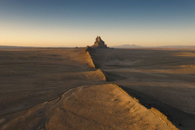 Scenic view of shiprock during sunset