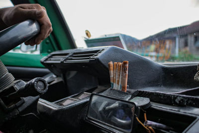 Close-up of man holding car