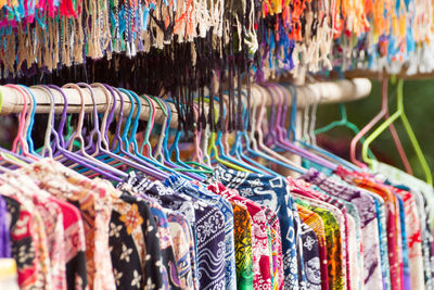 Full frame shot of colorful clothes hanging for sale
