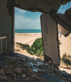 Sea seen through abandoned building