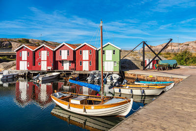 Boats moored at harbor