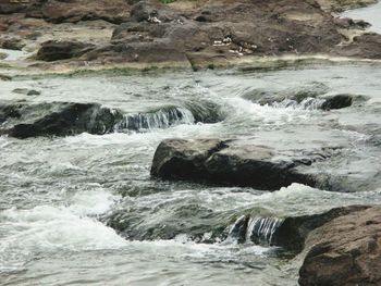 Waves flowing through rocks