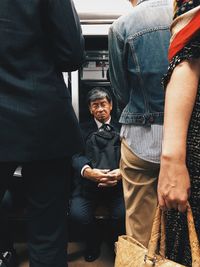 Rear view of couple standing in corridor