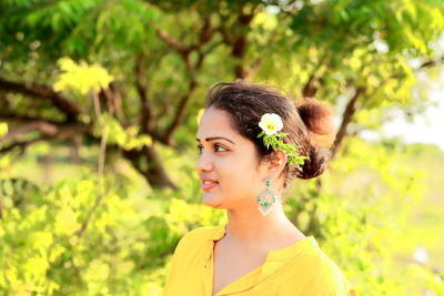 Portrait of young woman looking away