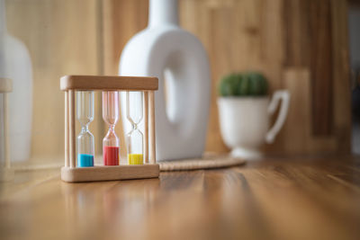 Close-up of hourglass on table