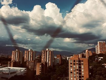 Buildings in city against sky