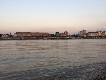 View of sea with buildings in background