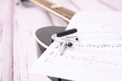 Close-up of guitar on table