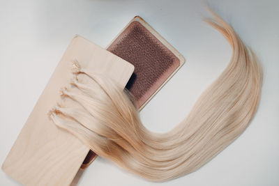 Close-up of open book on table against white background