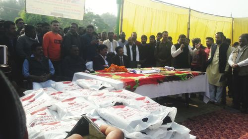 People looking at market stall in city