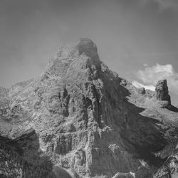 Low angle view of rock formation against sky