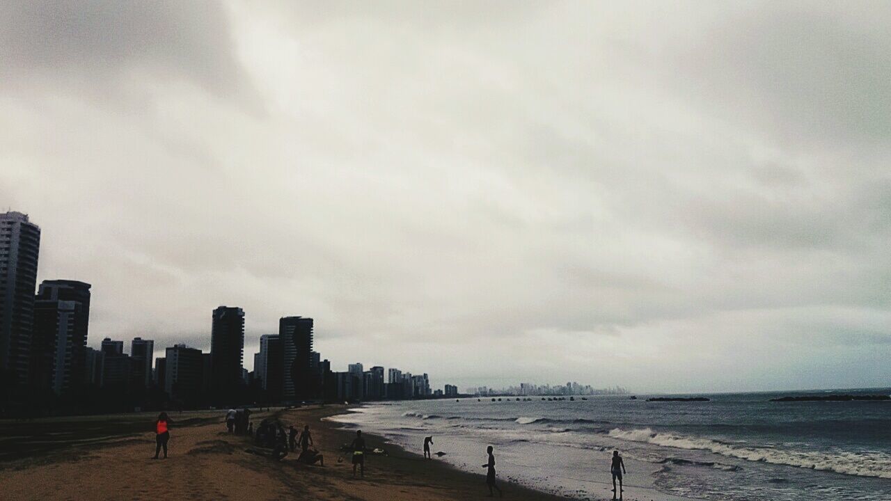 MAN STANDING ON BEACH