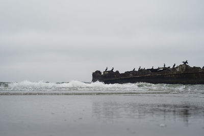 Scenic view of beach against sky