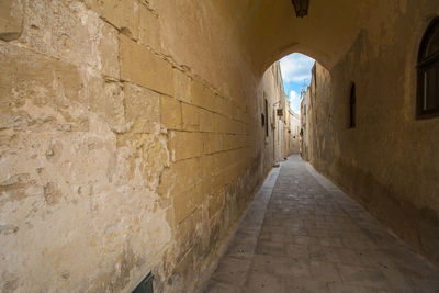 Empty alley amidst buildings, mdina, malta