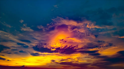 Low angle view of dramatic sky during sunset