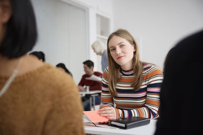 Portrait of smiling woman in class