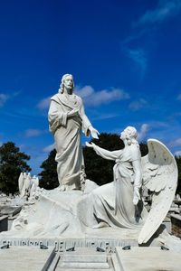 Low angle view of statue against sky