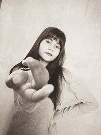 Portrait of a girl giving her hand