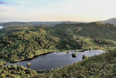 Calm lake along countryside landscape