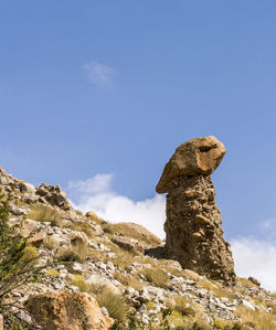 Low angle view of statue against sky