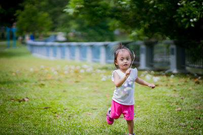 Portrait of cute girl in grass