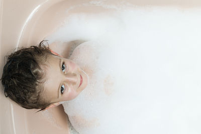 Portrait of boy in bathtub