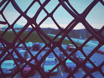 Full frame shot of sea seen through chainlink fence