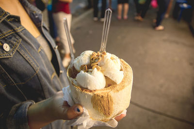 High angle view of person holding ice cream