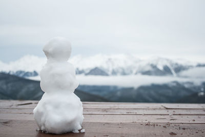 Snow on mountain against sky