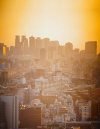 Cityscape against sky during sunset