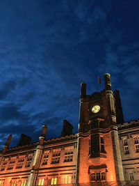 Low angle view of historic building against sky at dusk