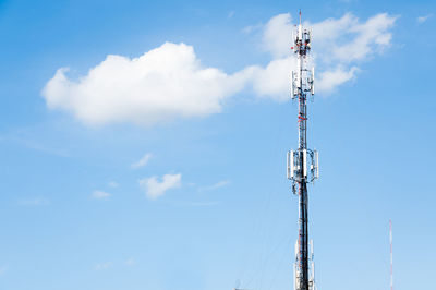 Low angle view of communications tower against sky