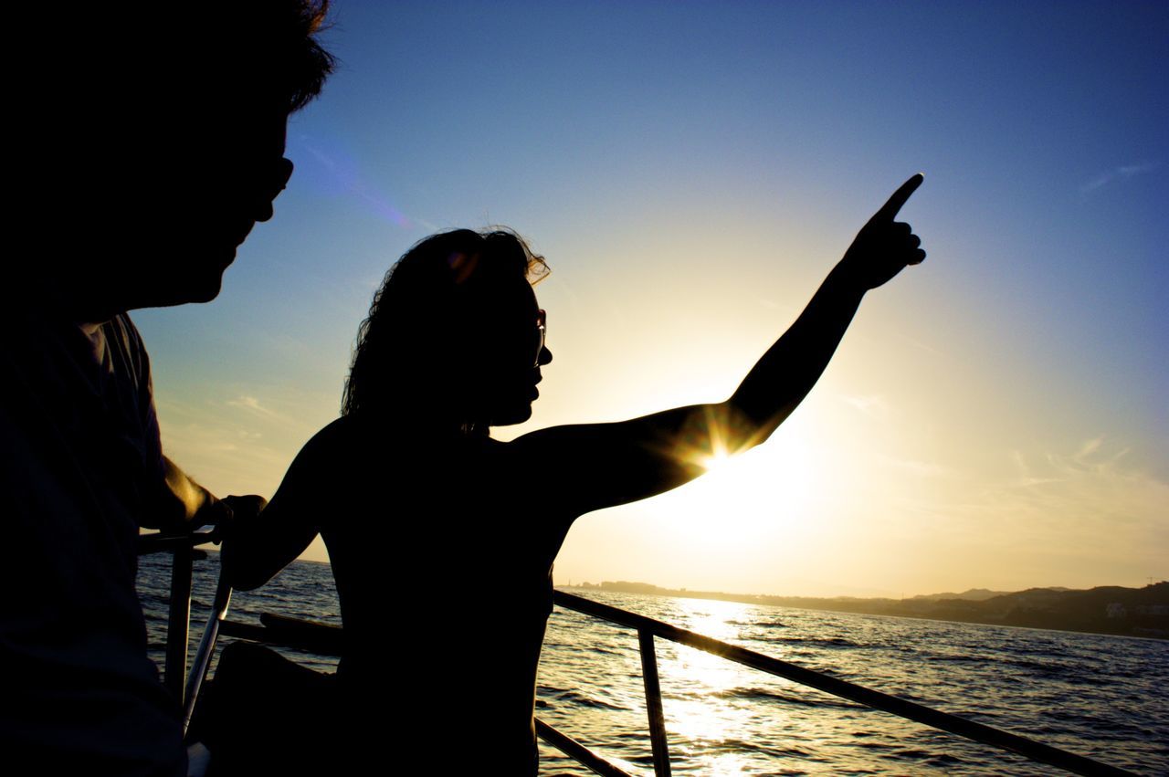 SILHOUETTE MAN AT BEACH DURING SUNSET