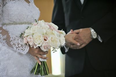 Midsection of couple during wedding