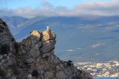 Rock formations on landscape against sky