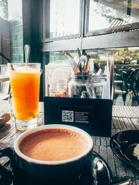 Close-up of coffee served on table at cafe